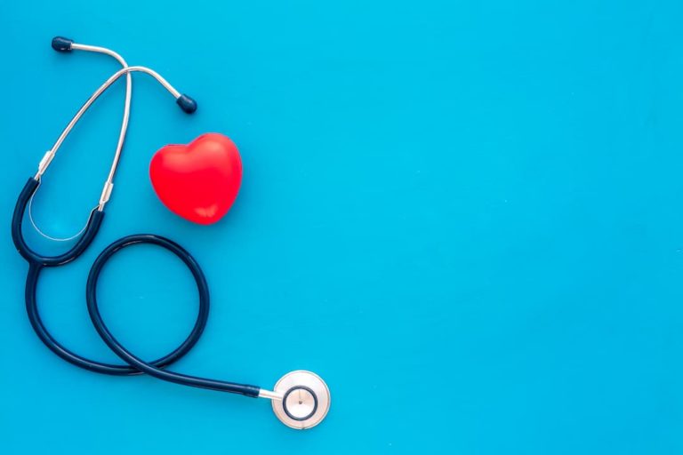 Image Of A Red Heart With A Stethoscope On A Blue Background