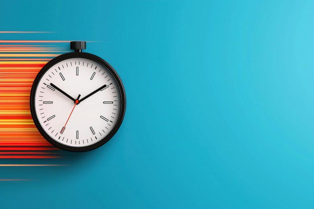 a clock with speed marks on a blue background