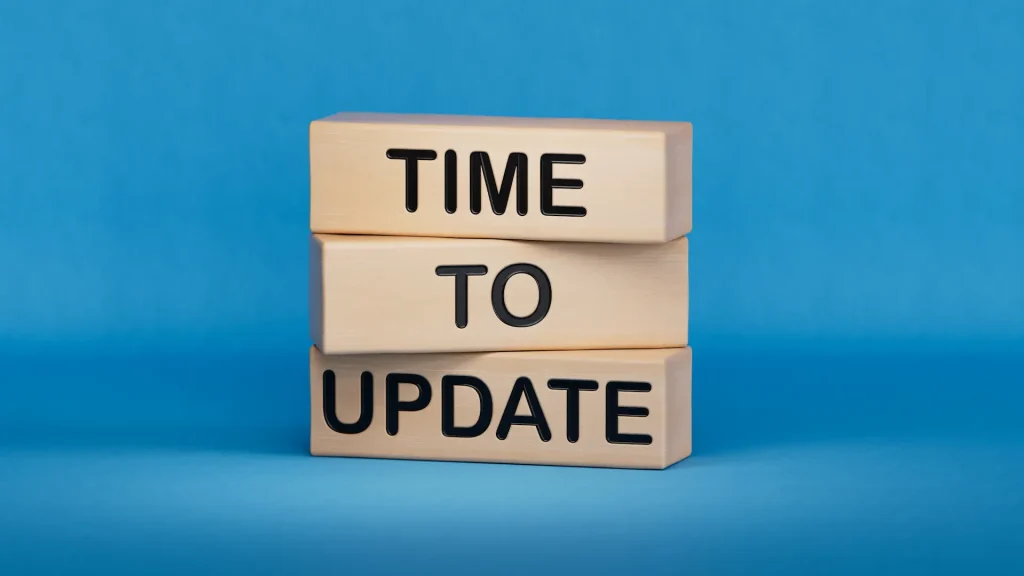 wooden cube block with word TIME TO UPDATE. Update website content concept. Wooden cube blocks. Copy space.3D rendering on blue background.